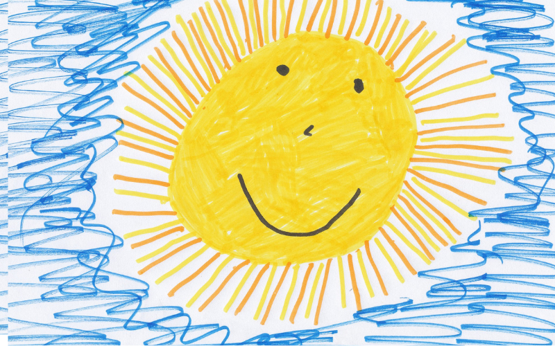 Auf dem Bild ist eine von einem Kind gemalte Sonne zu sehen
